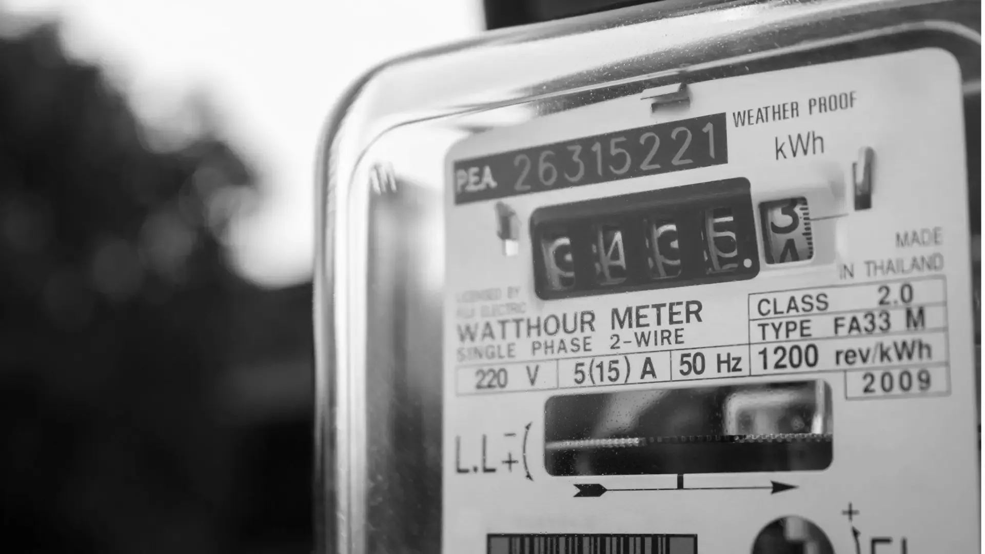 Close-up of an analogue watt-hour meter recording kilowatt hours